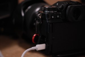 The Fujifilm X-T4 connected to a laptop with a white USB-C cable